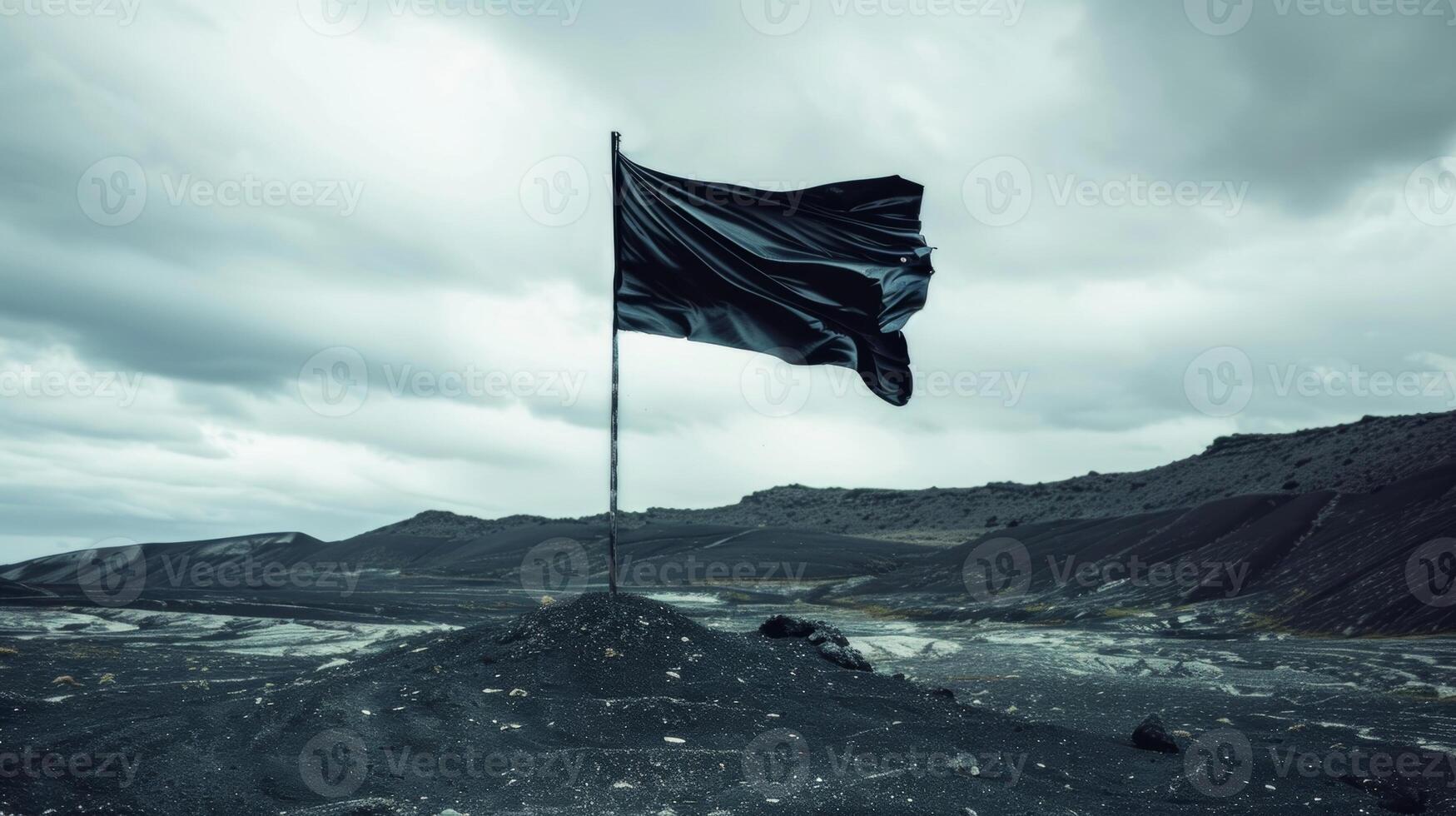 In a stark landscape a black flag flies upwards its ascent signifying triumph over adversity photo