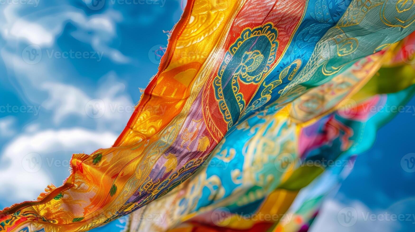 A closeup of a vibrant prayer flag depicting intricate symbols and mantras as it dances to the rhythm of the wind photo