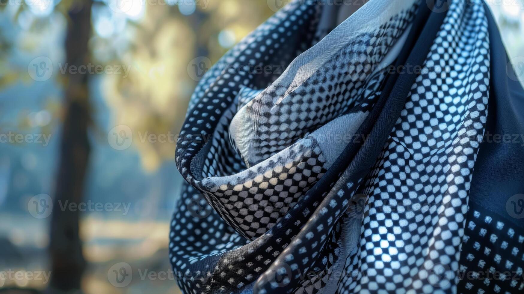 A classic black and white foulard scarf flutters gracefully adding a hint of sophistication to a casual ensemble photo