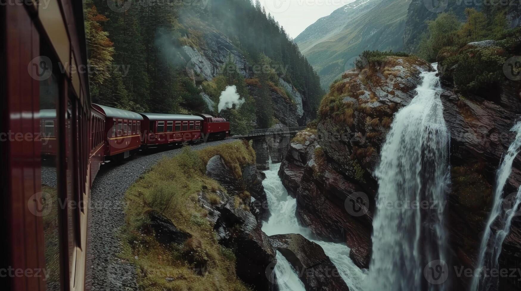 As the train moves through the mountains waterfalls seem to follow its path photo