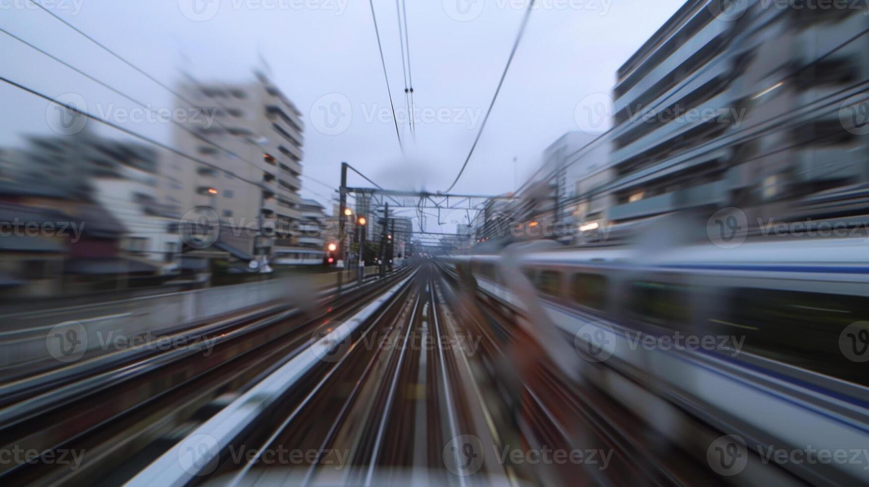 The rush of wind and sound of the city seems to blend together as I ride the train photo