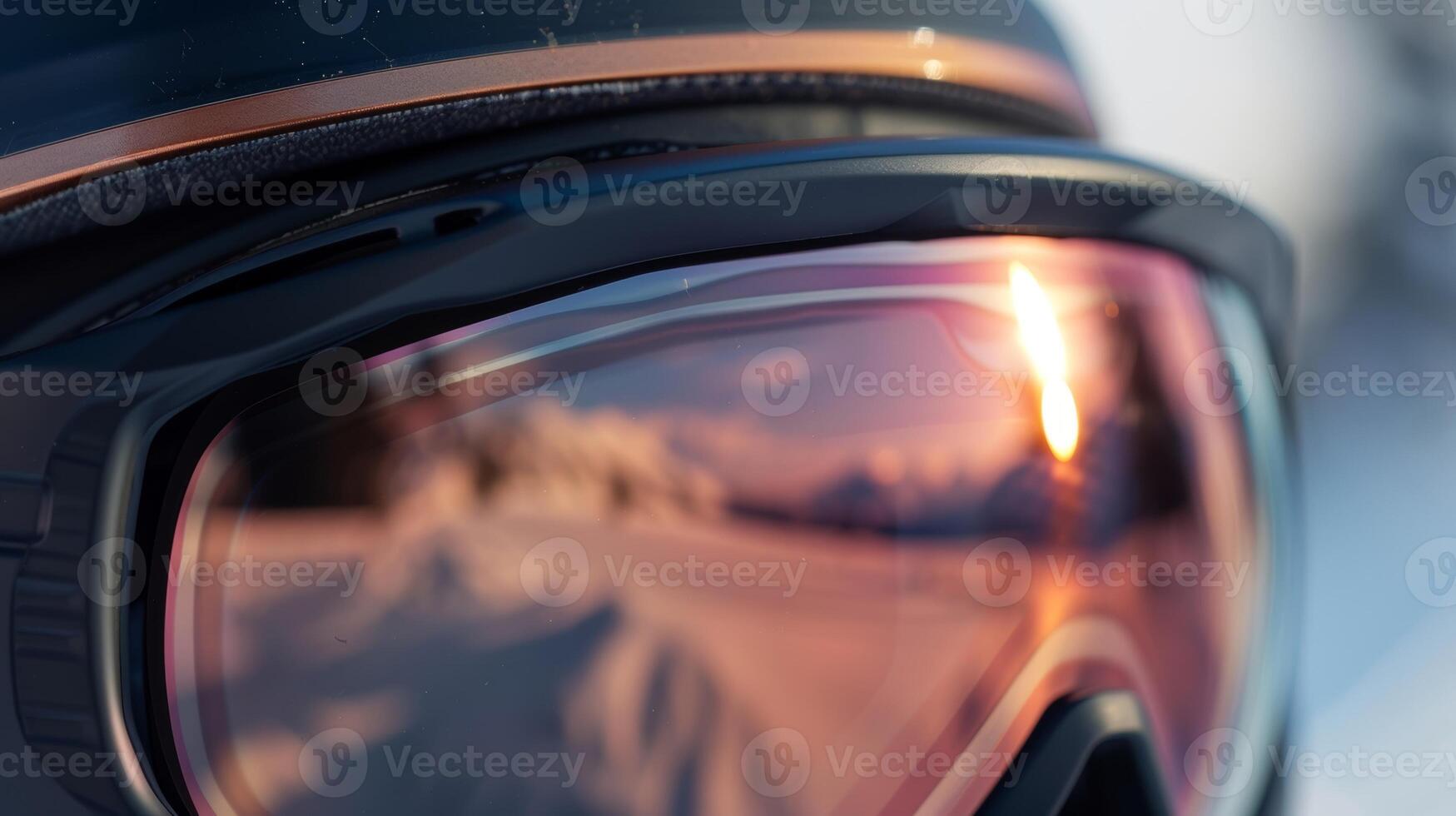 The lens of the goggles has a sleek gradient tint transitioning from rose gold at the top to a deep bronze at the bottom photo