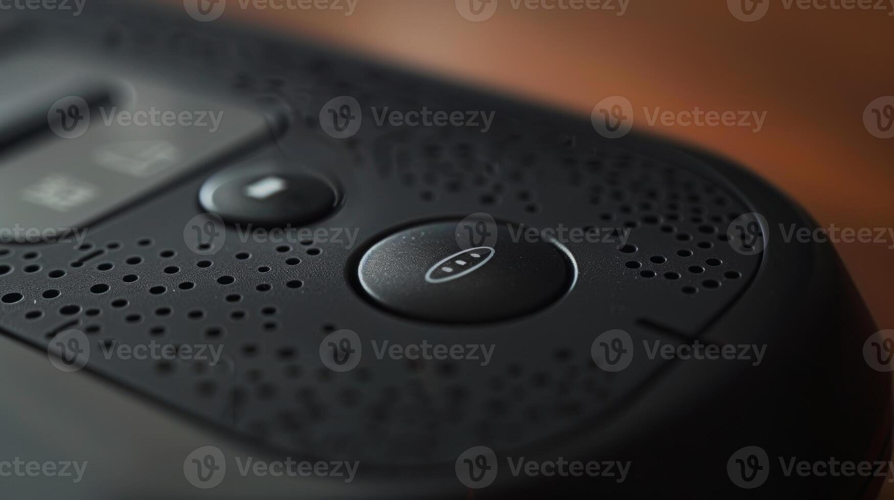 A zoomedin view of the power button on a streaming device remote with subtle grooves for easier pressing photo
