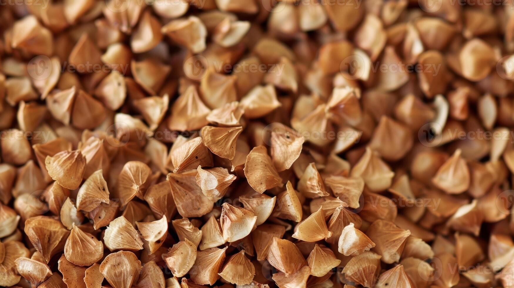 An image of buckwheat groats the tiny triangular seeds that make up the edible part of the plant photo