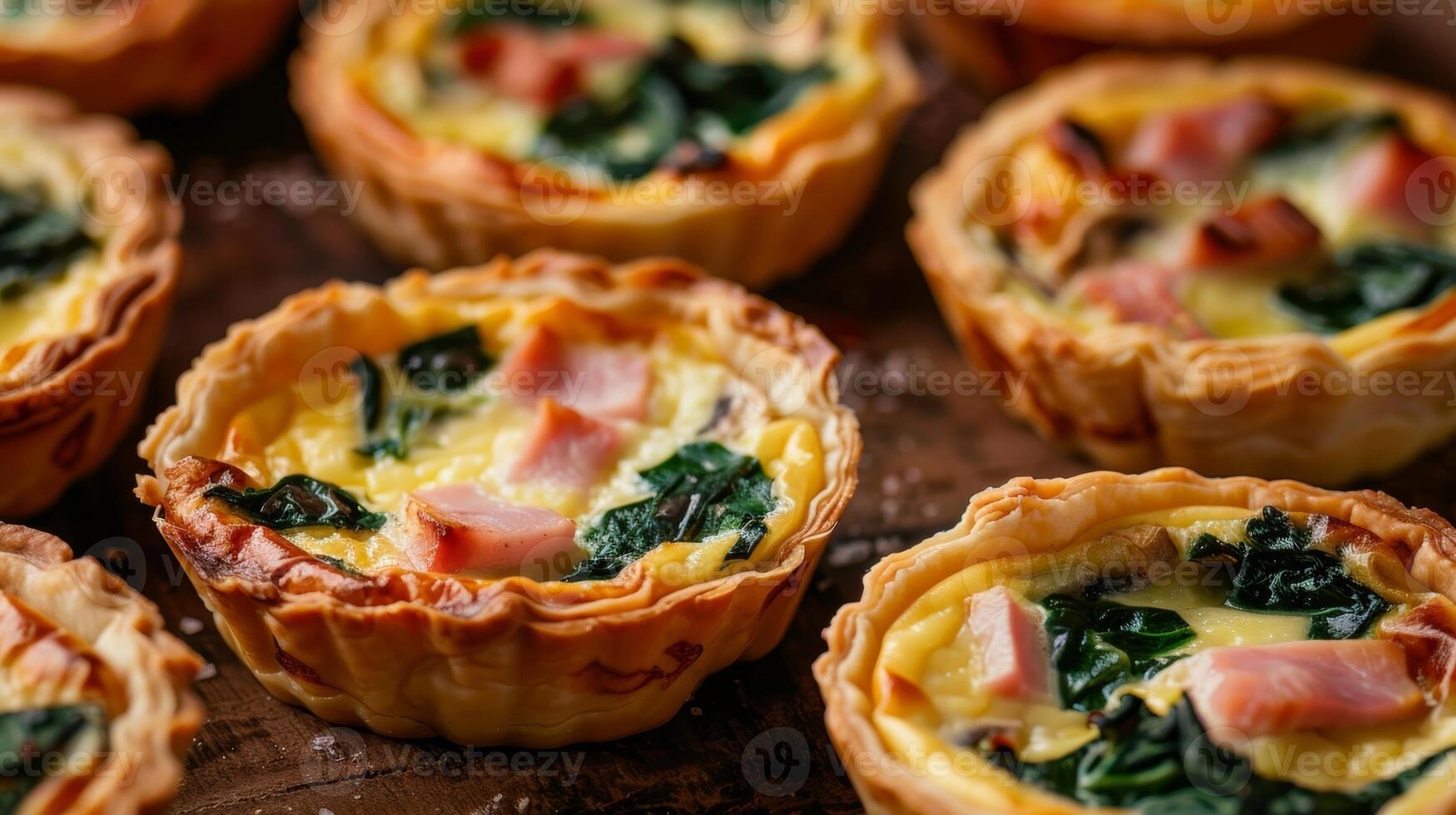 Quiches with a variety of fillings such as spinach and mushroom or ham and cheese satisfy a range of tastes photo