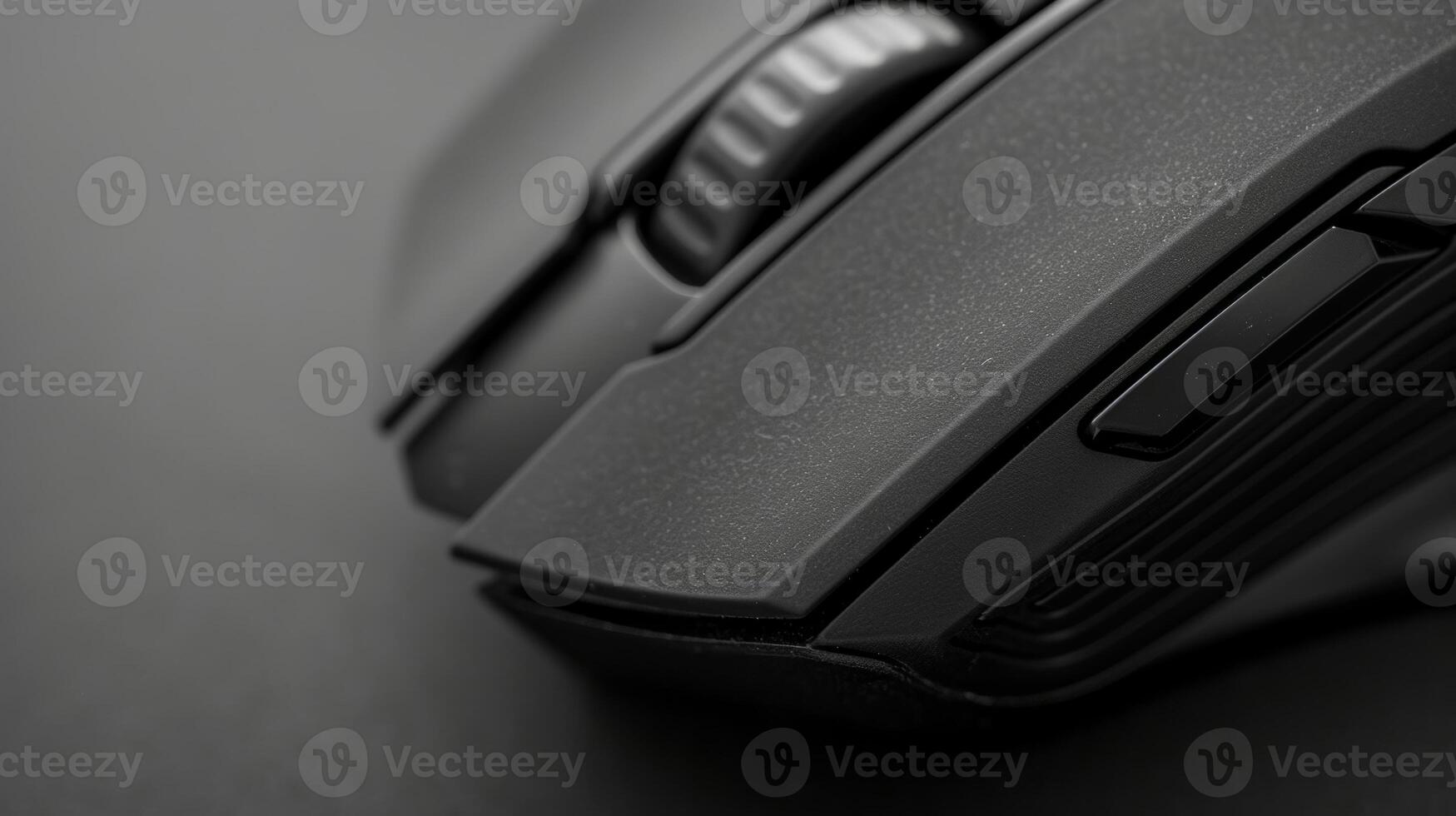 A closeup of a matte black wireless mouse highlighting its ergonomic design for comfortable use photo