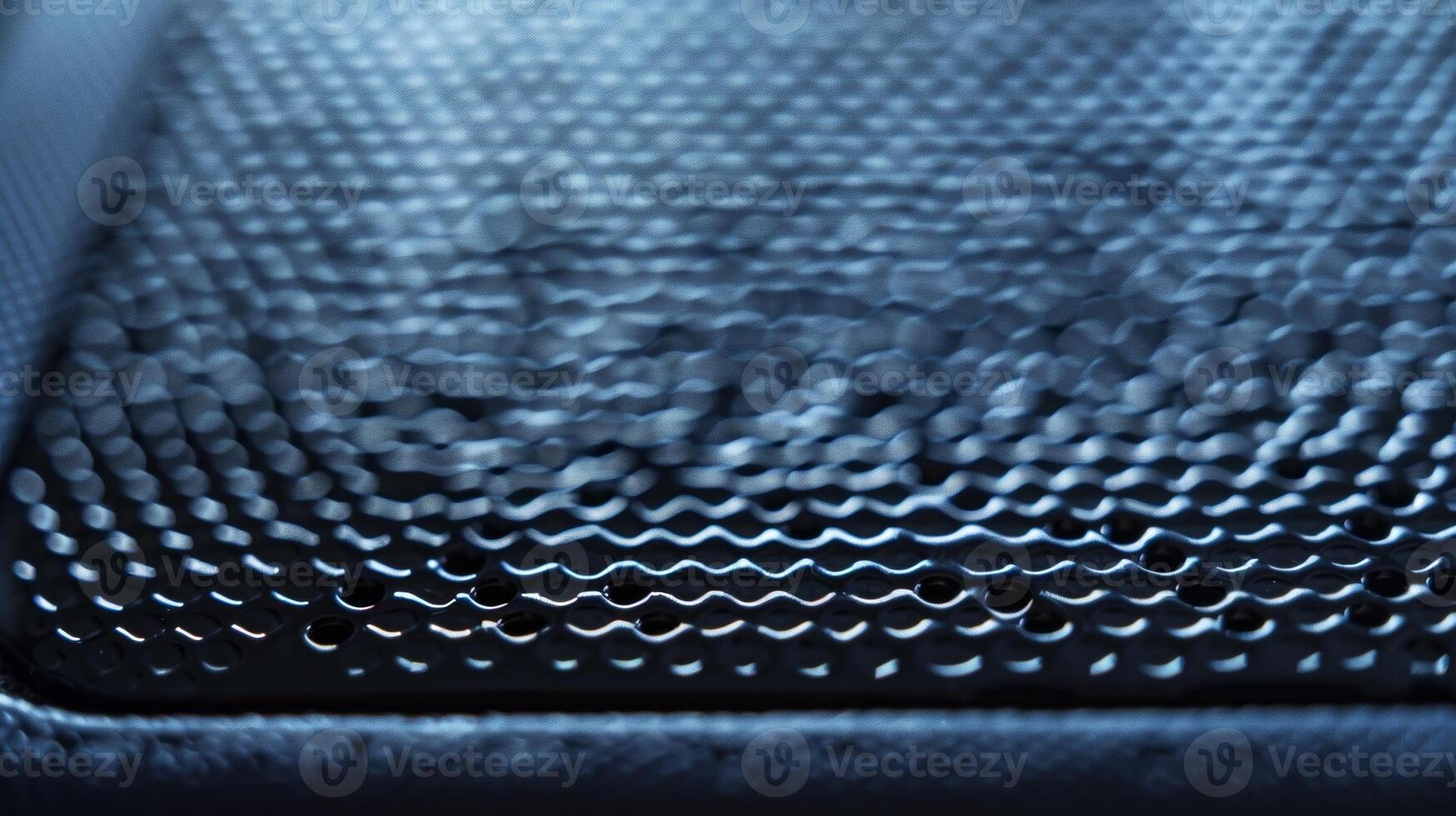A detailed closeup of a portable SSD captures the fine details of its textured surface providing a secure grip for handling photo