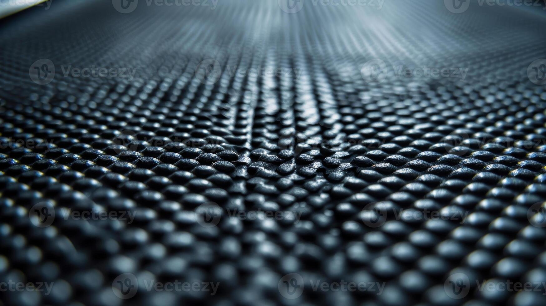 Closeup of the textured nonslip surface of a smart treadmill belt providing traction and stability for runners during intense workouts photo
