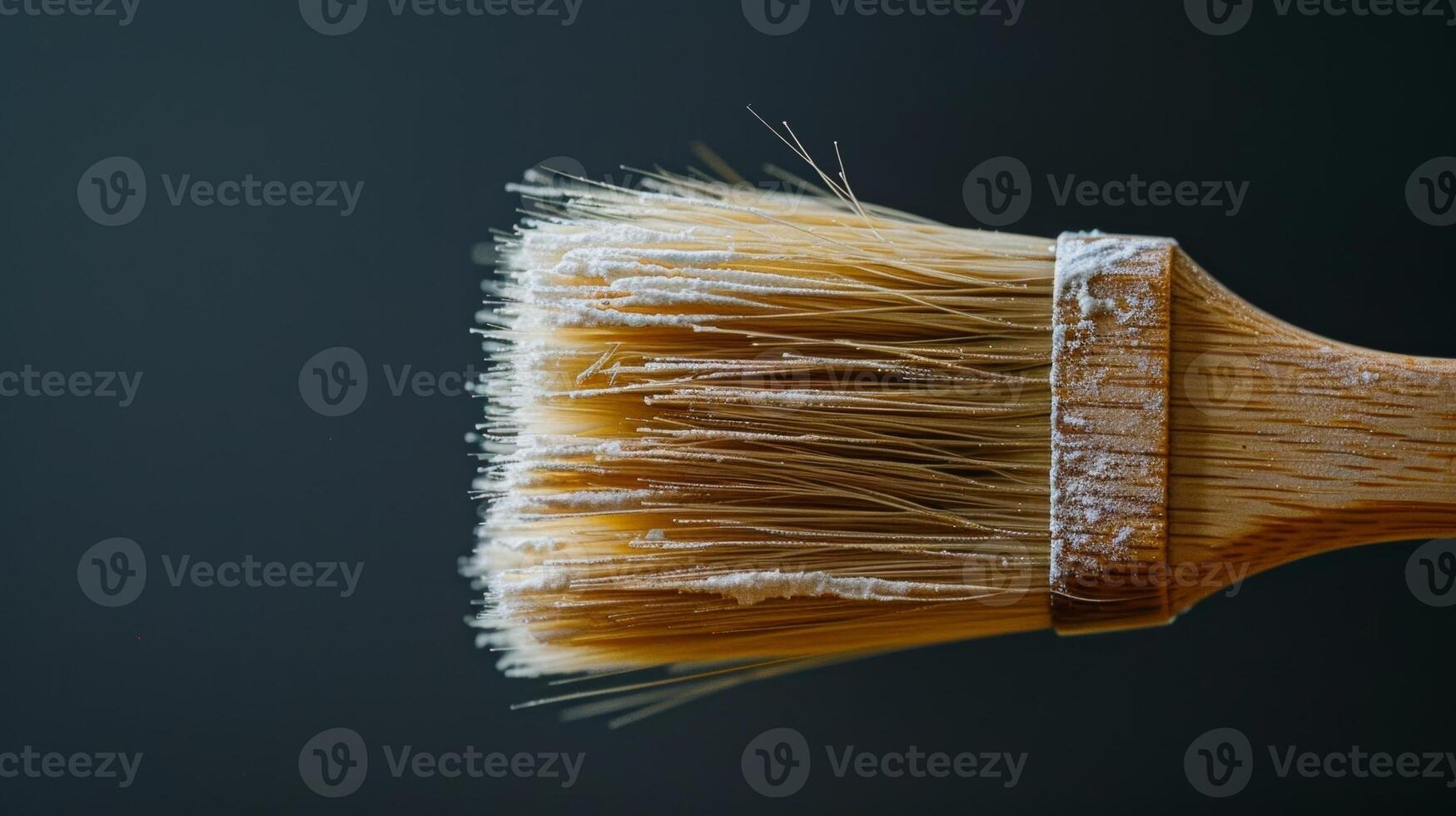 A professionalgrade pastry brush with soft natural bristles and a wooden handle perfect for brushing on egg wash or glazes for a glossy finish photo
