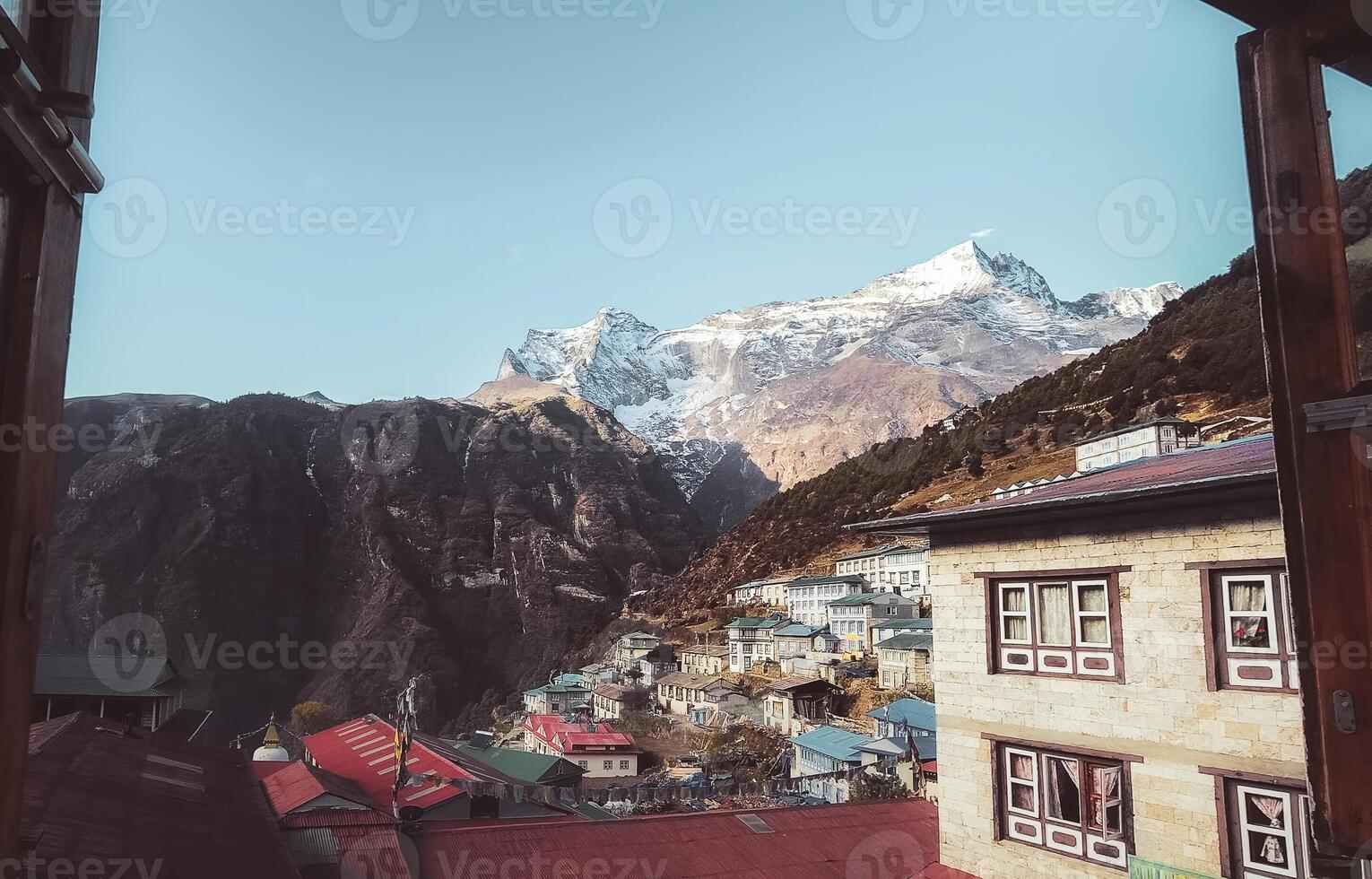 POV Guesthouse window view Namche Bazaar town in Khumbu Pasanglhamu Rural Municipality in Solukhumbu District. Khumbu valley stays. Typical traditional houses and Nepalese culture photo