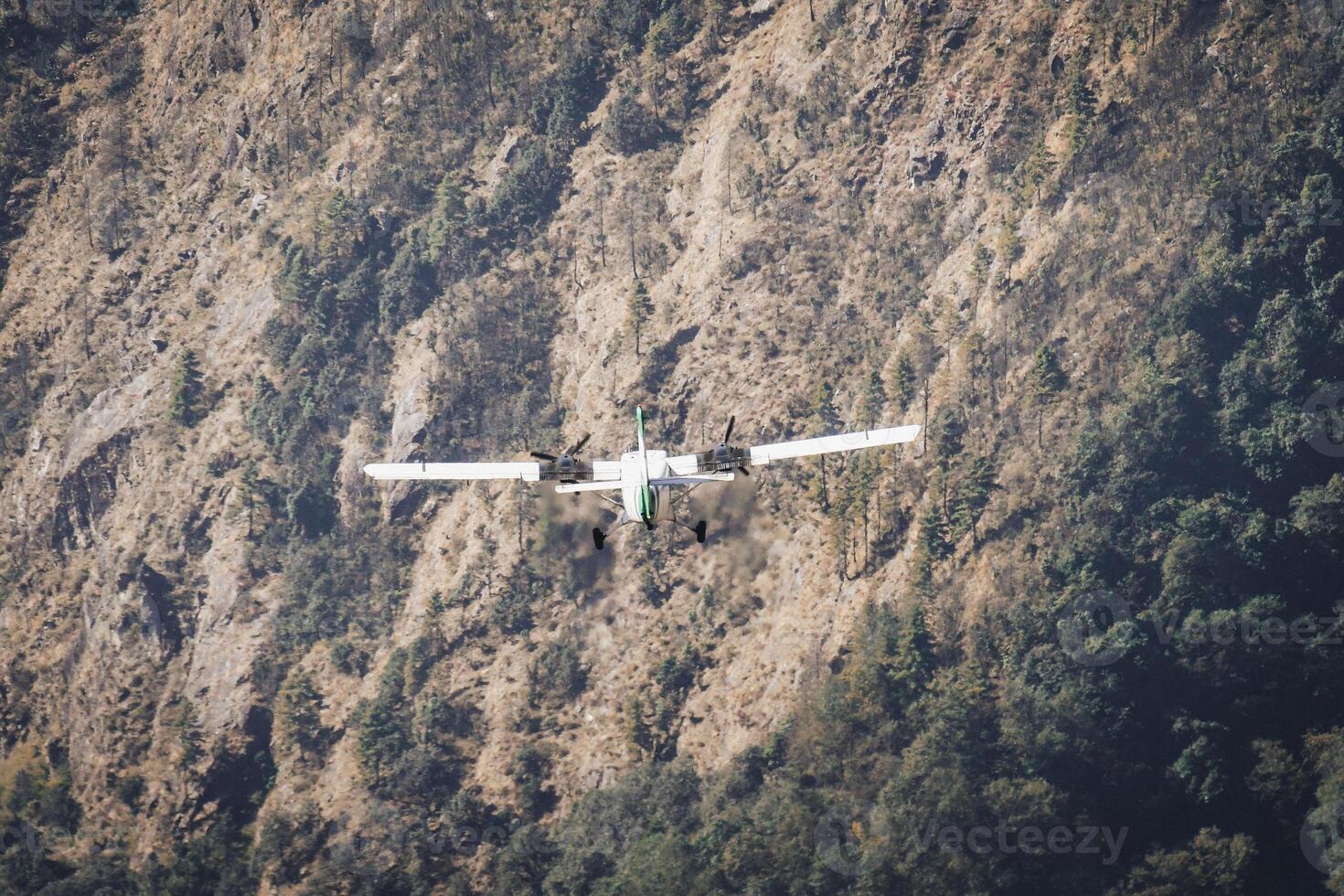 Lukla, Nepal - 14th november, 2023 - small aircraft takes off on the runway of the Tenzing-Hillary airport Lukla - Nepal, Himalayas photo