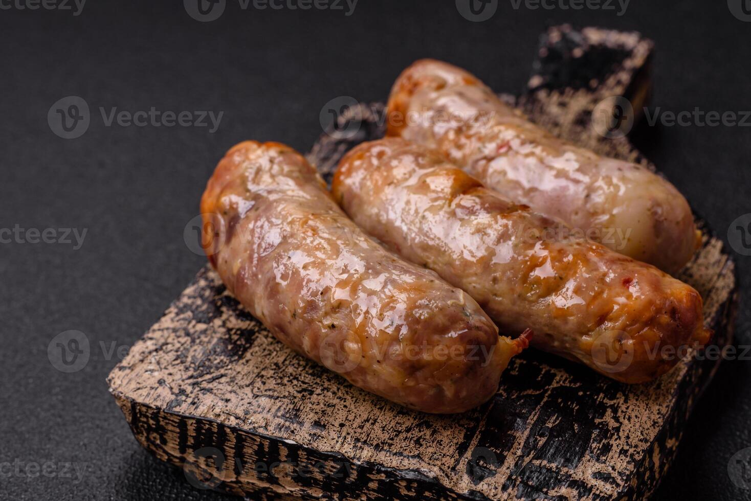 Baked chicken or pork sausages, salt, spices and herbs photo