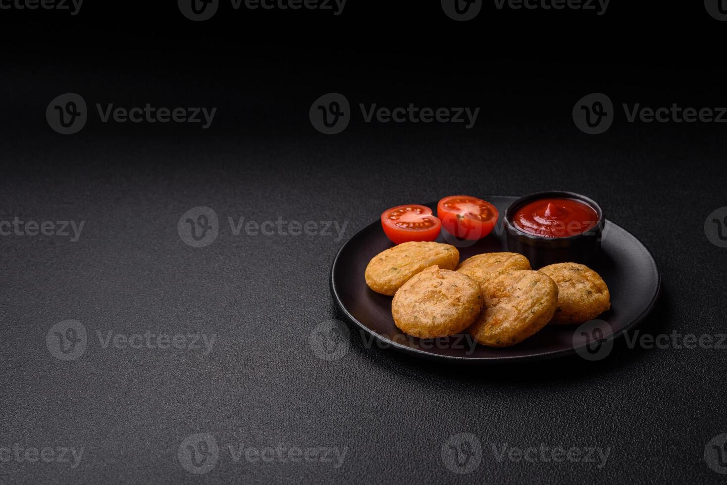 Round fish or chicken nuggets with salt and spices photo