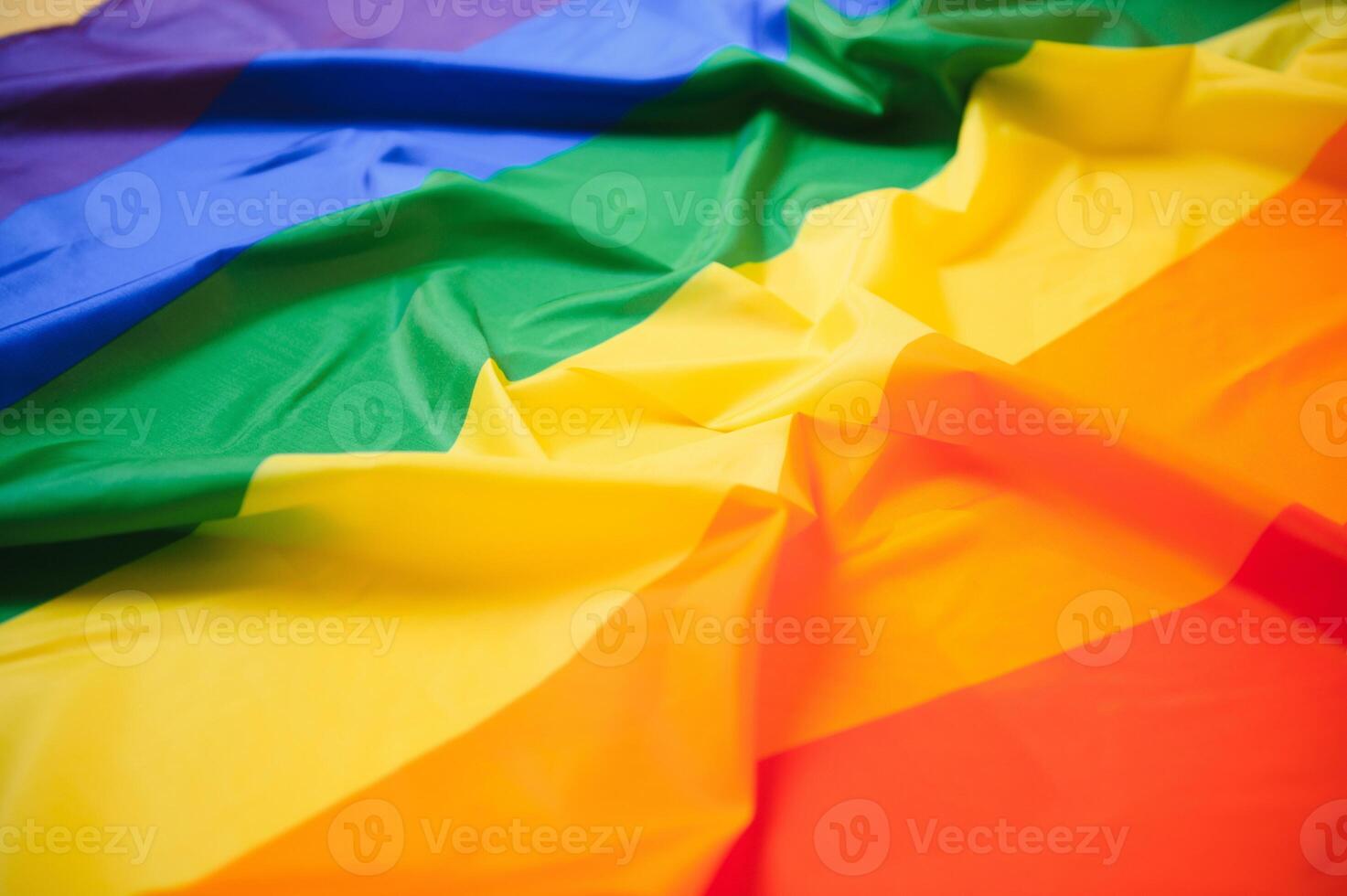 waving colorful rainbow gay flag . macro shot photo