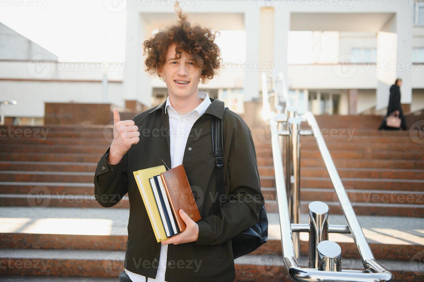 Cute school boy outside classroom photo