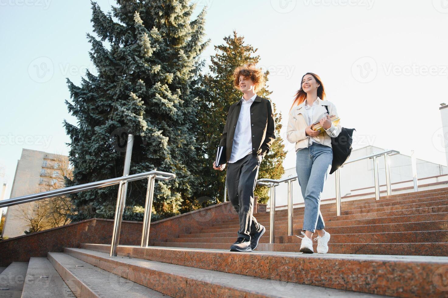 Education, campus, friendship and people concept. Group of happy students outdoor photo