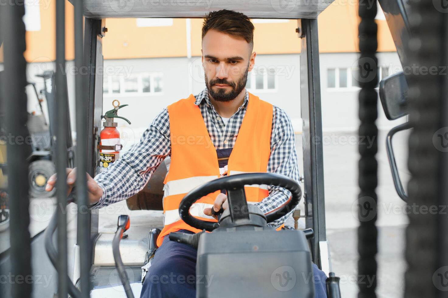 Man working at warehouse and driving forklift photo