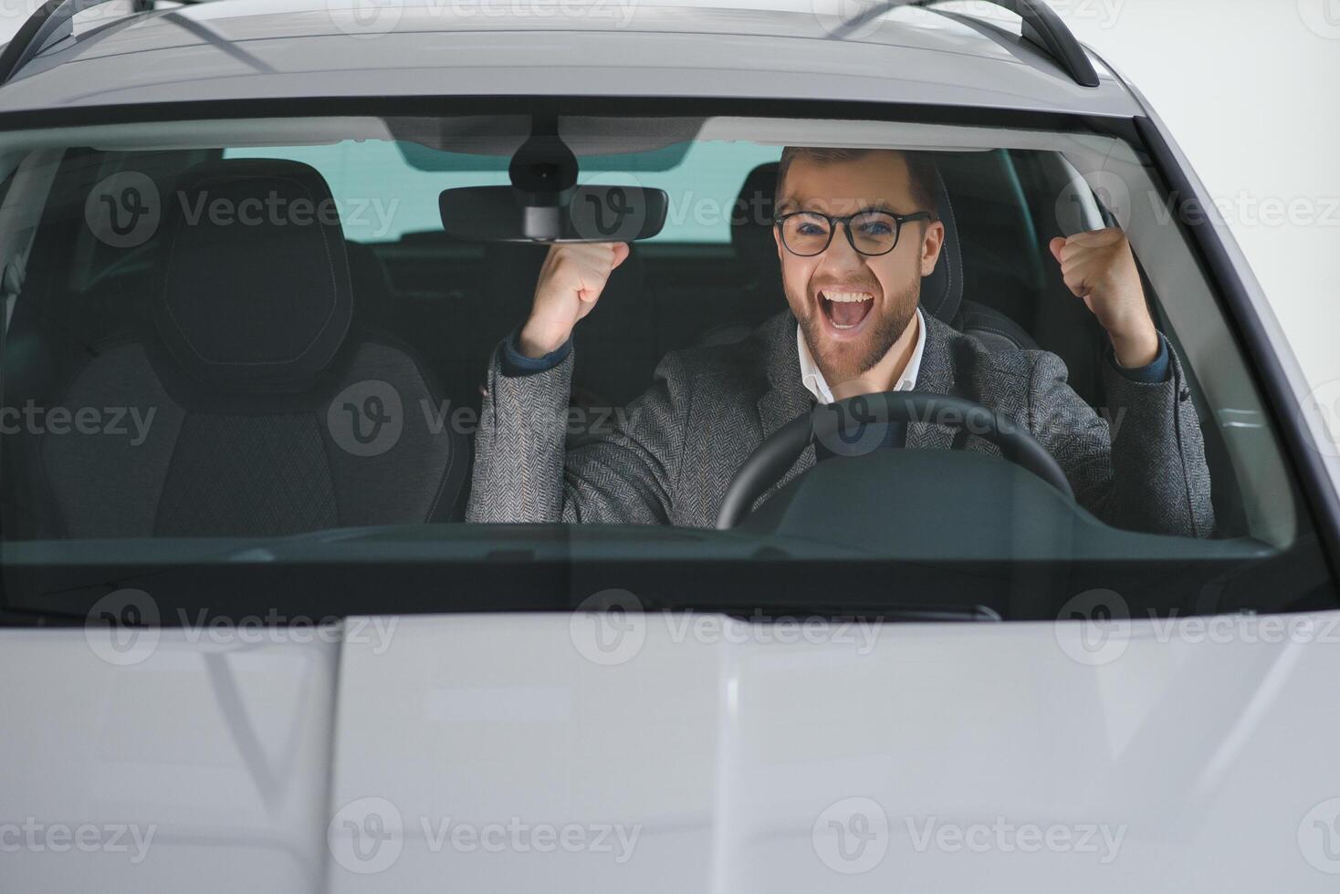 Man adult customer male buyer client wears classic suit white shirt chooses auto wants to buy new automobile touch check car in showroom vehicle salon dealership store motor show indoor. photo