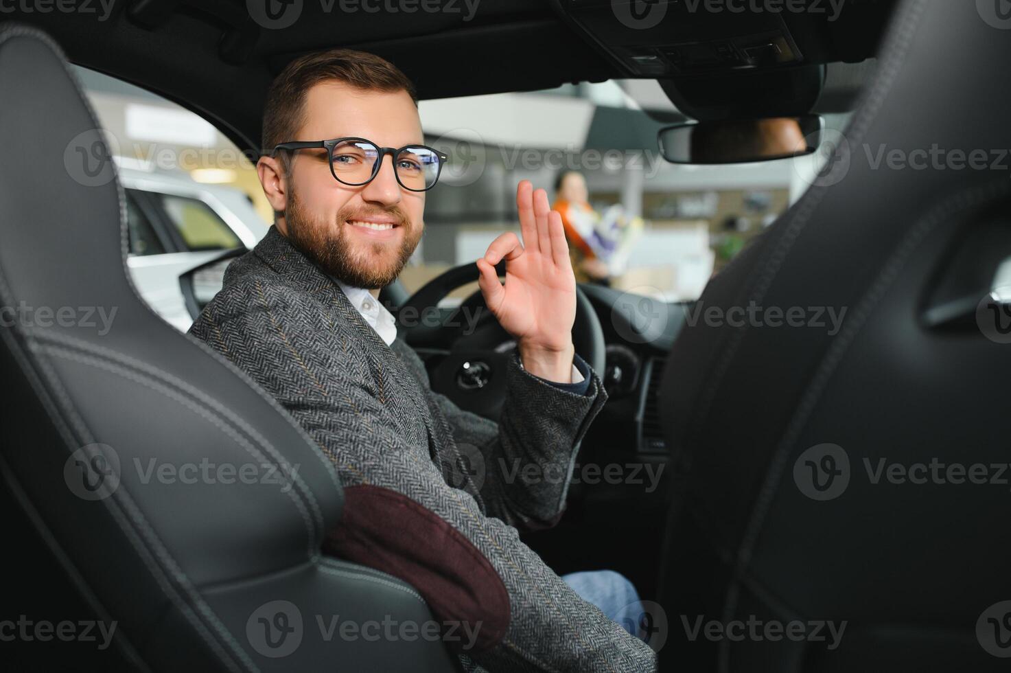 Man adult customer male buyer client wears classic suit white shirt chooses auto wants to buy new automobile touch check car in showroom vehicle salon dealership store motor show indoor. photo