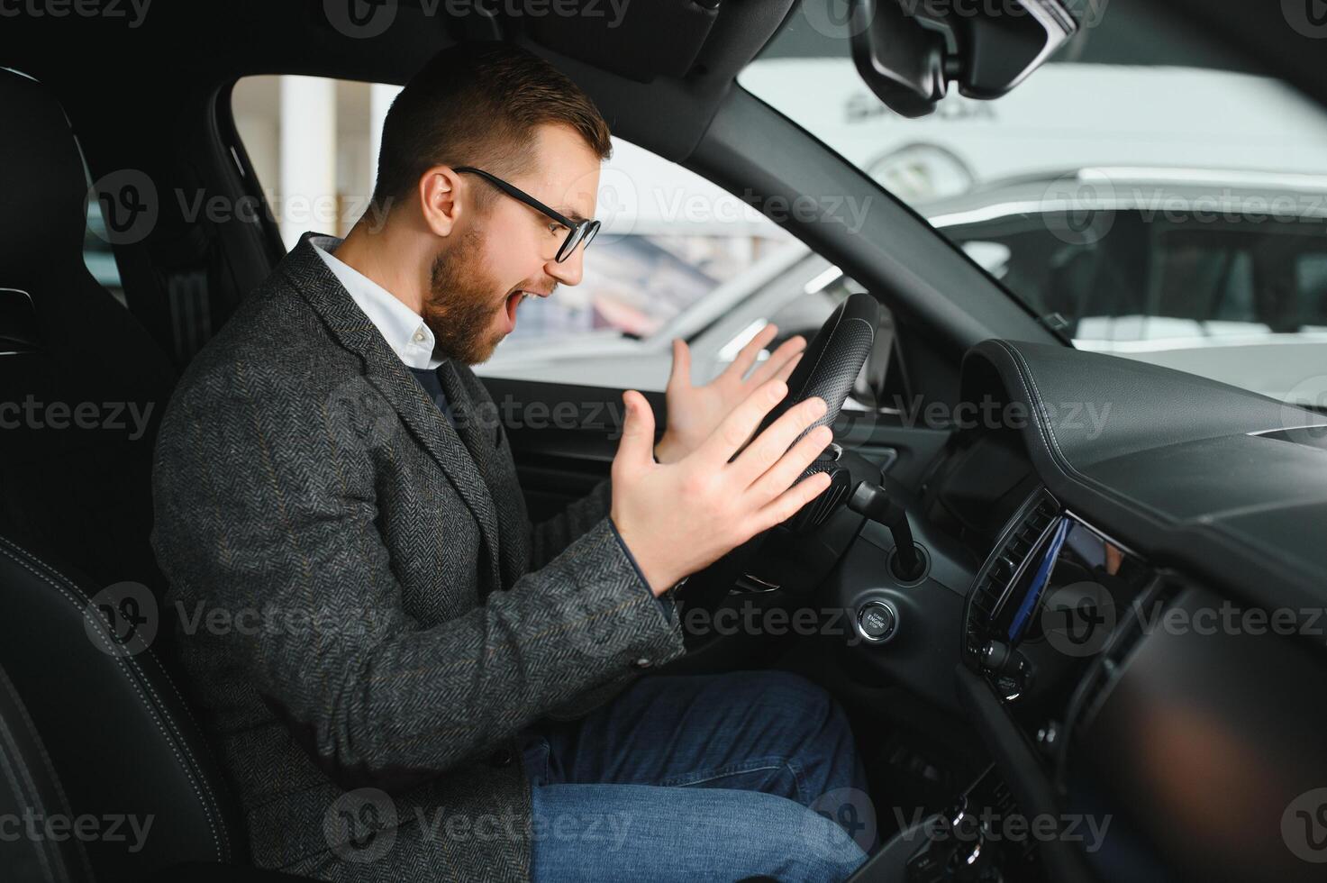 His true love. Portrait of a mature man smiling happily sitting in a brand new car photo