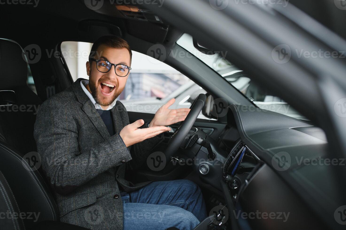 Man adult customer male buyer client wears classic suit white shirt chooses auto wants to buy new automobile touch check car in showroom vehicle salon dealership store motor show indoor. Sales concept photo