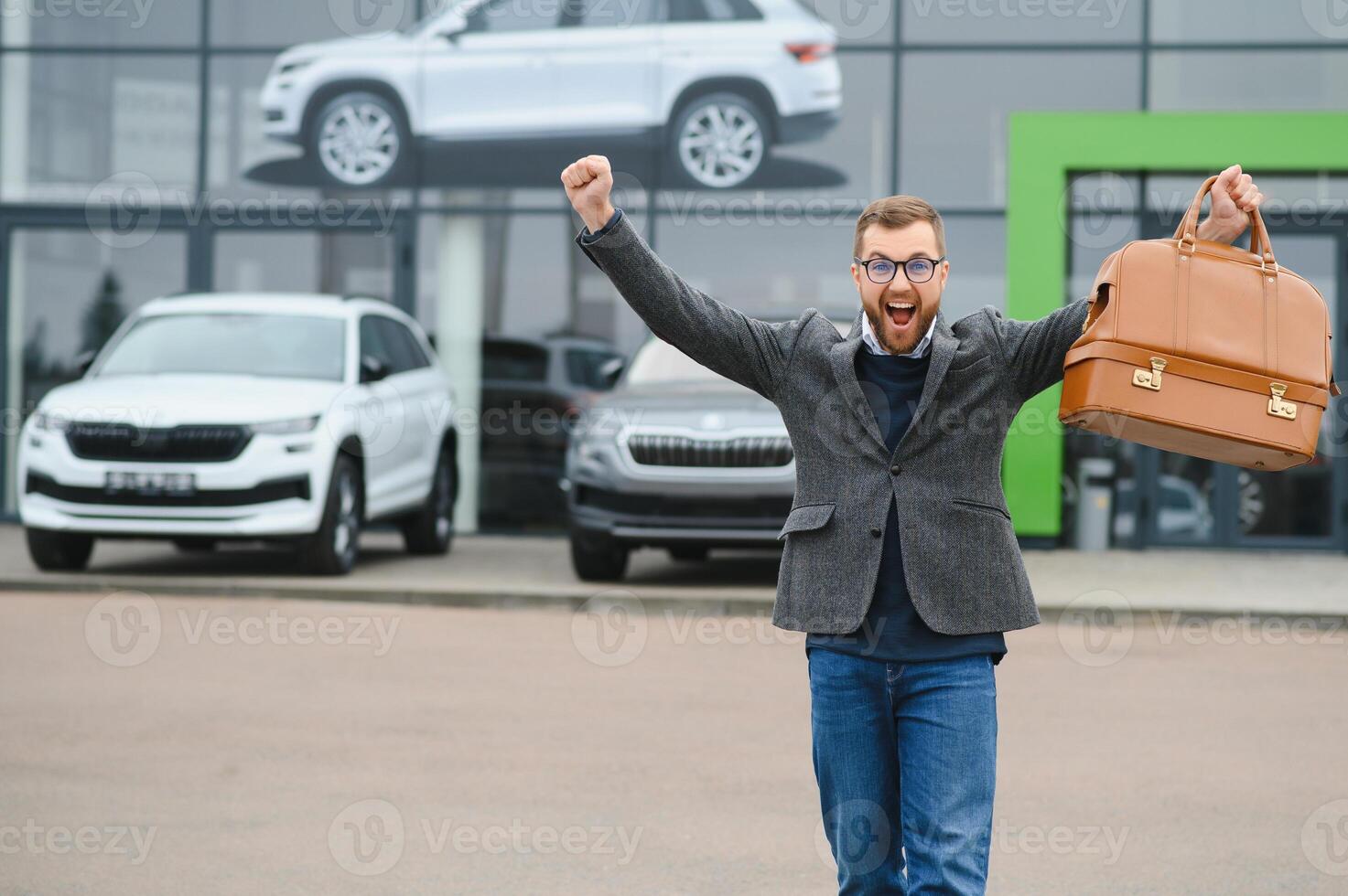 Portrait of happy customer buying new car. photo