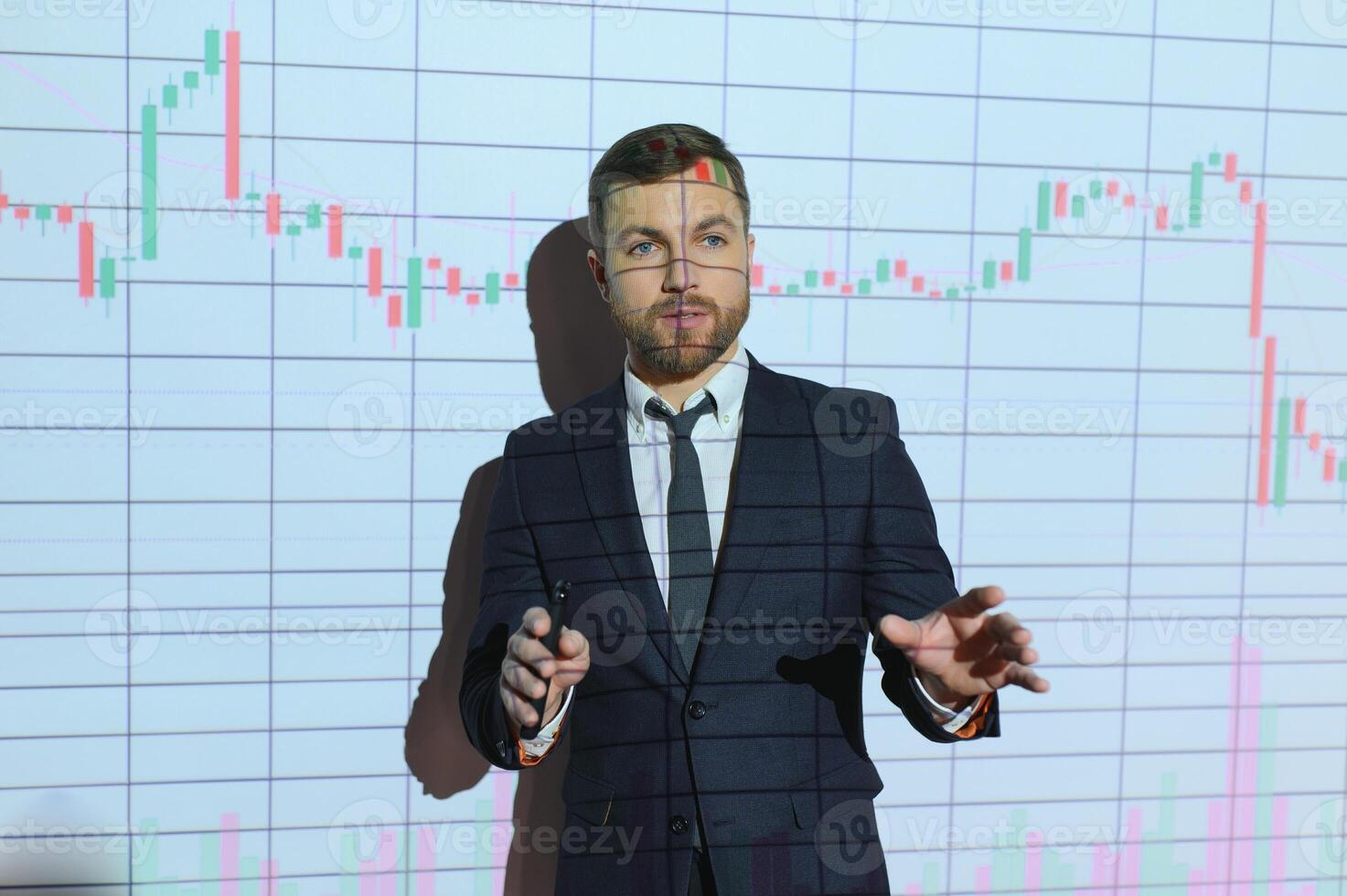 Portrait of concerned European businessman thinking in blurry office with double exposure of falling financial chart. Concept of crisis and stock market. photo