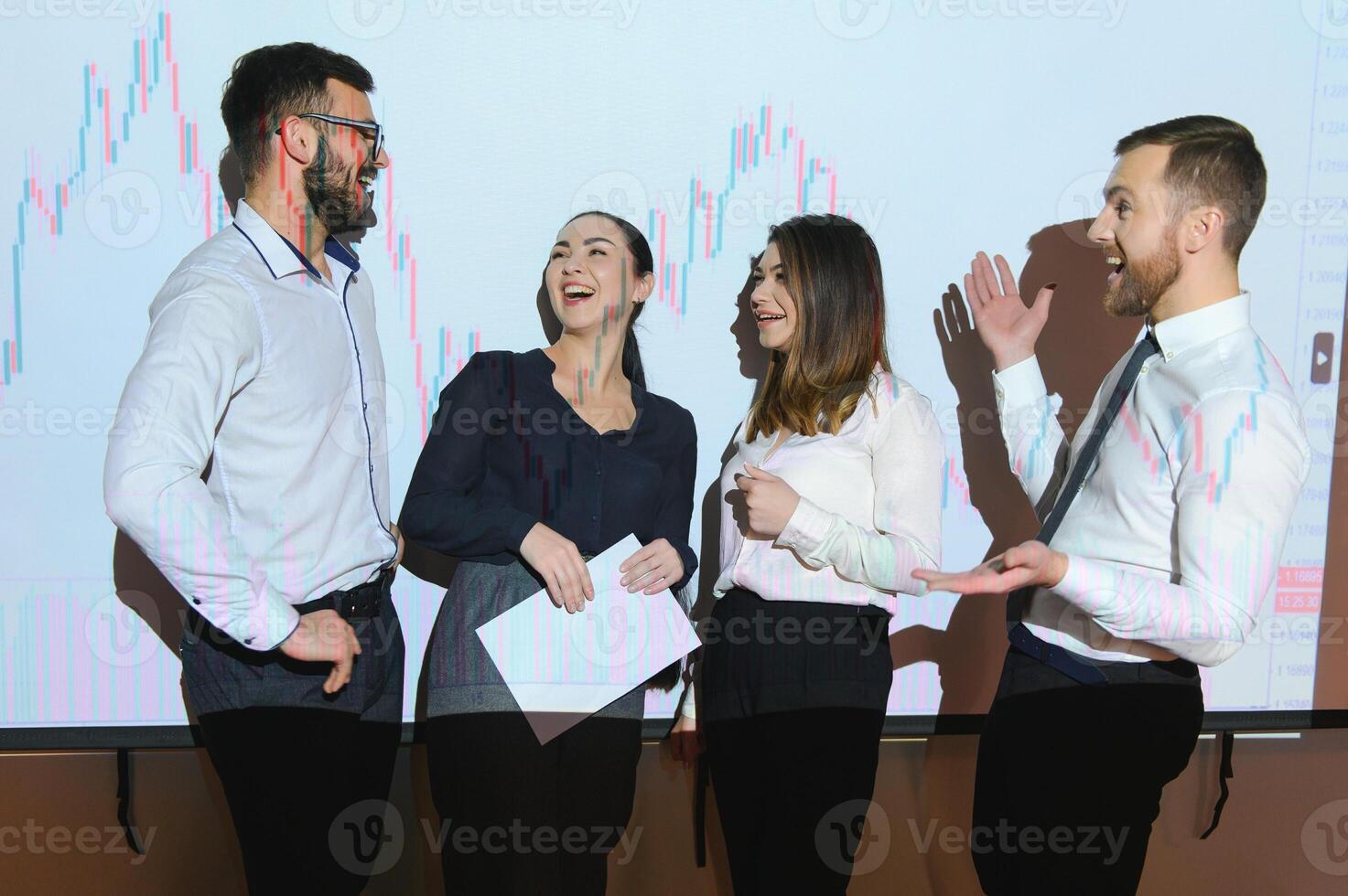 Group of business people working. Technical price graph and indicator, red and blue candlestick chart and stock trading computer screen background. Traders analyzing data photo