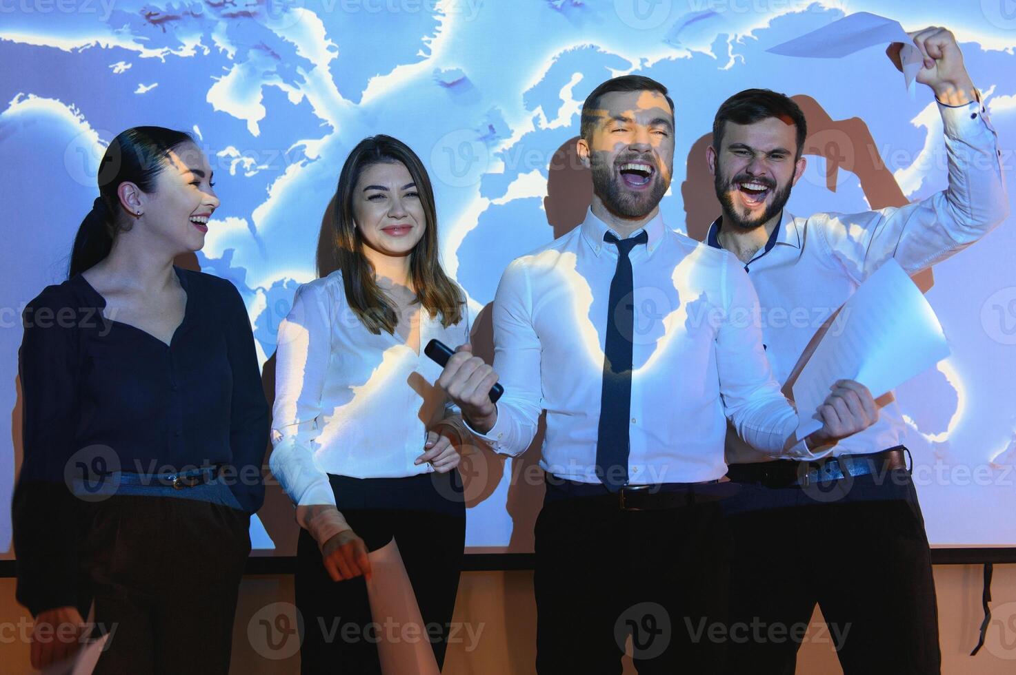 Image of businesspeople standing against world map background photo