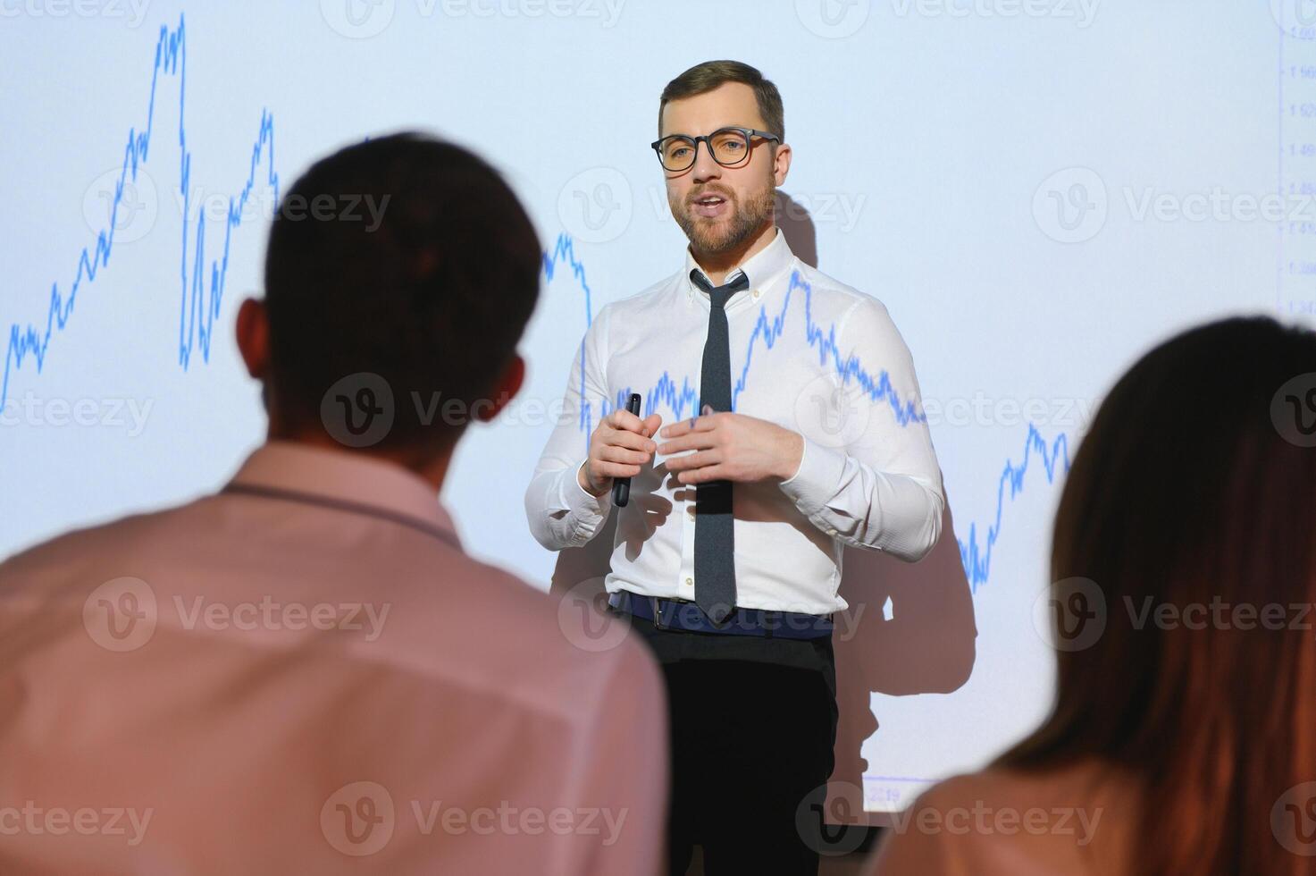 Analyzing data, graphs and reports for investment purposes. Creative teamwork traders. photo