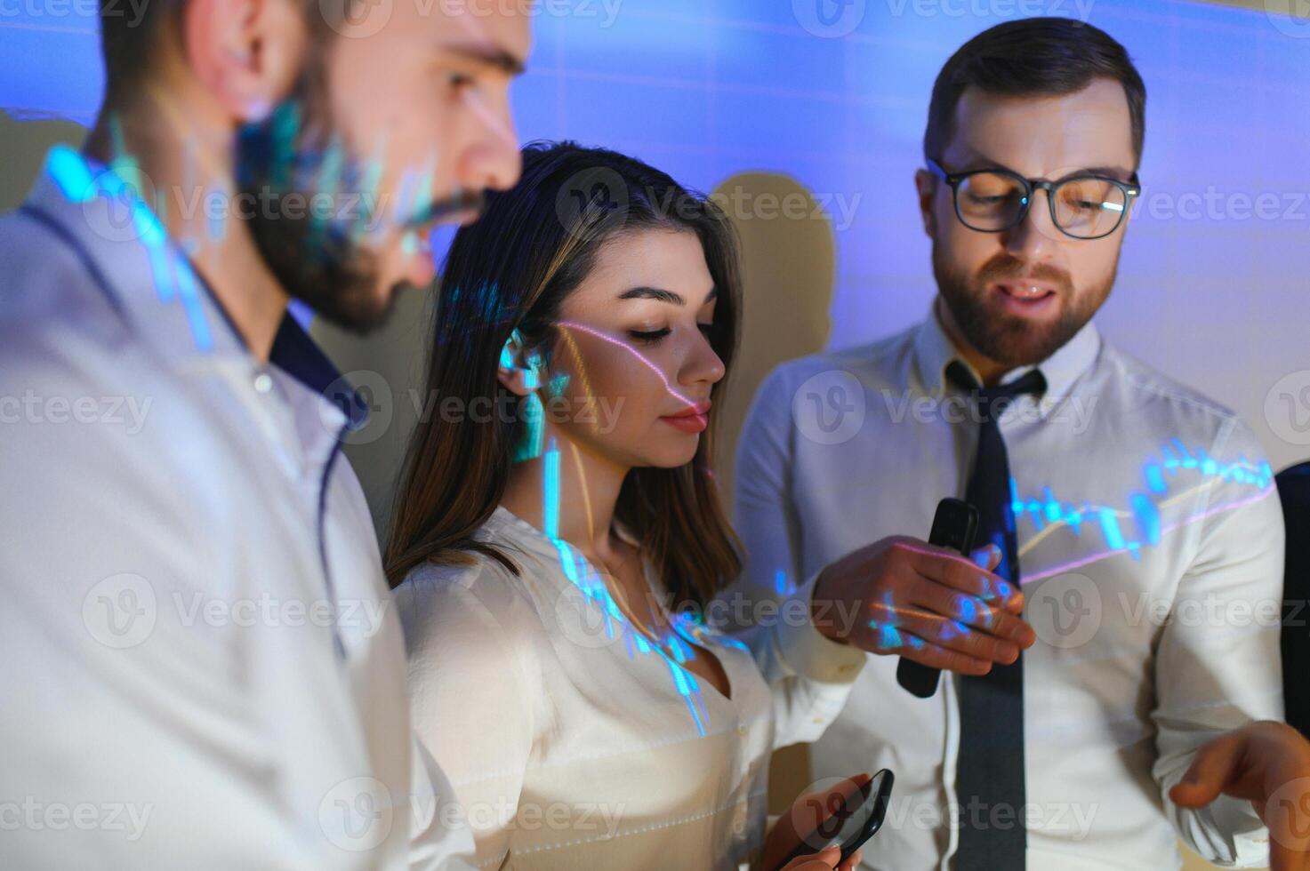 Group of business people working at modern office.Technical price graph, red and blue candlestick chart and stock trading computer screen background. Double exposure. Traders analyzing data photo