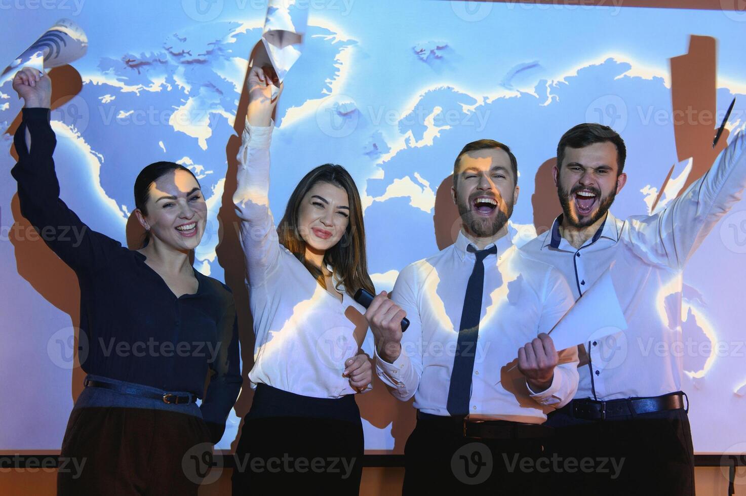 Image of businesspeople standing against world map background photo