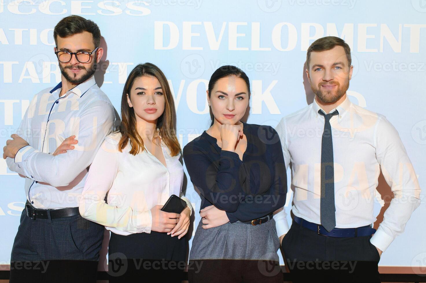 group of business people on the background of motivational words photo