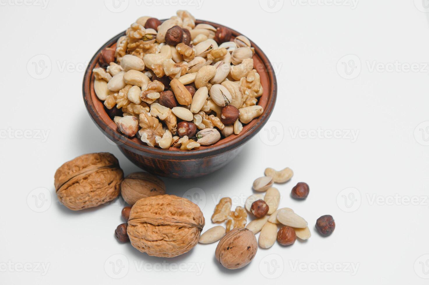 Mixed nuts on a plate. White background photo
