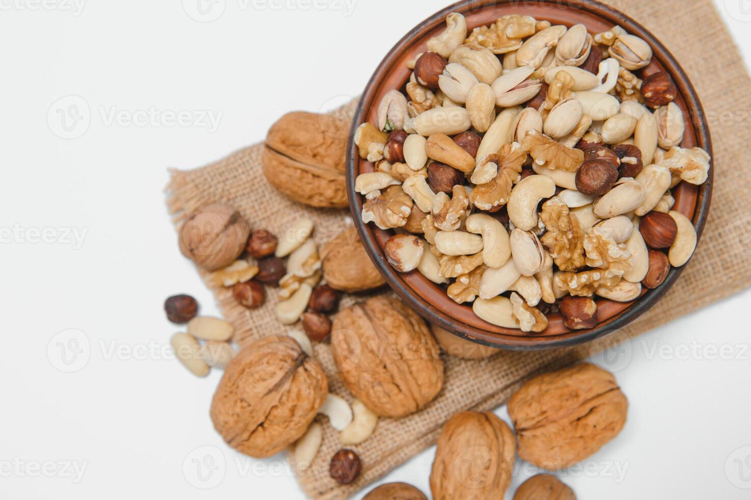 Mixed nuts on a plate. White background photo