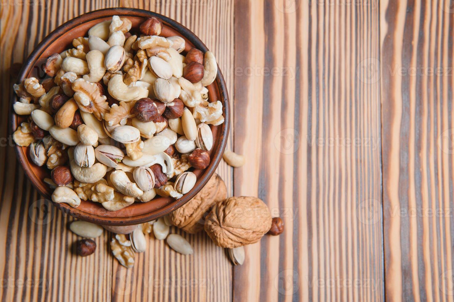 mix nuts on a wooden table photo