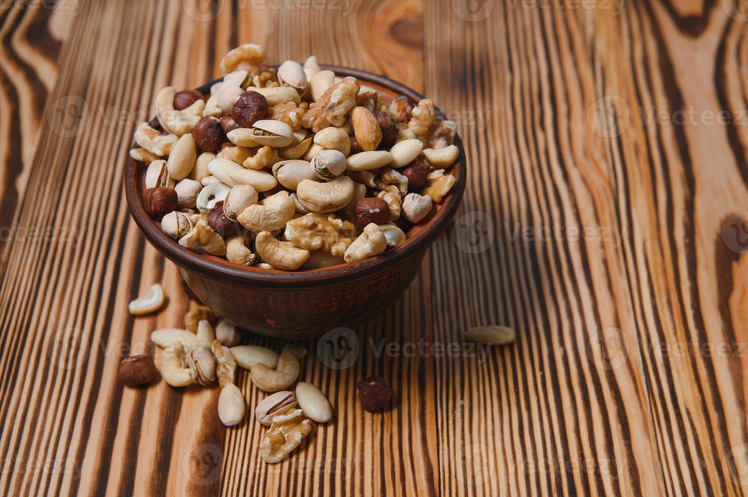 mix nuts on a wooden table photo