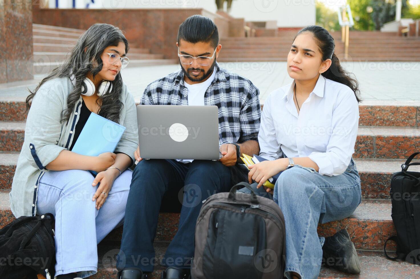 Group of smiling multiethnic near university campus photo