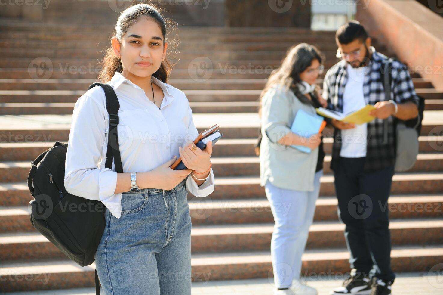 Group of Indian or Asian college students in the campus photo