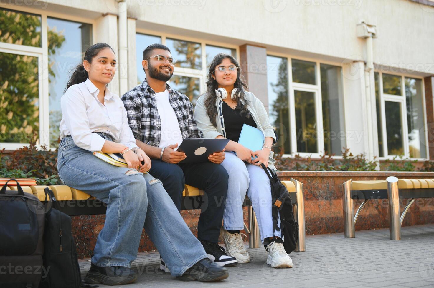 Cheerful Indian asian young group of college students or friends together photo