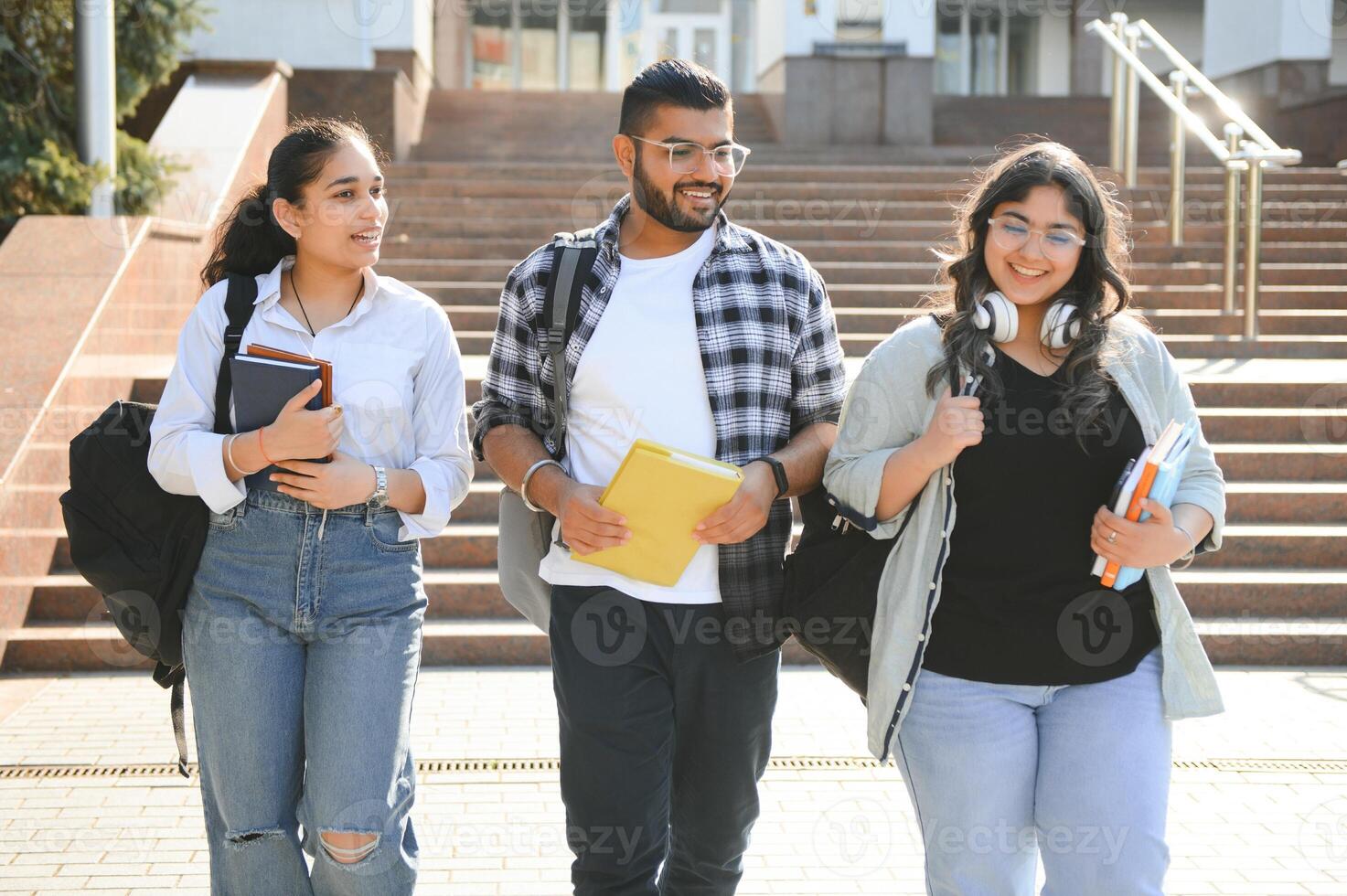 Cheerful Indian asian young group of college students or friends together photo