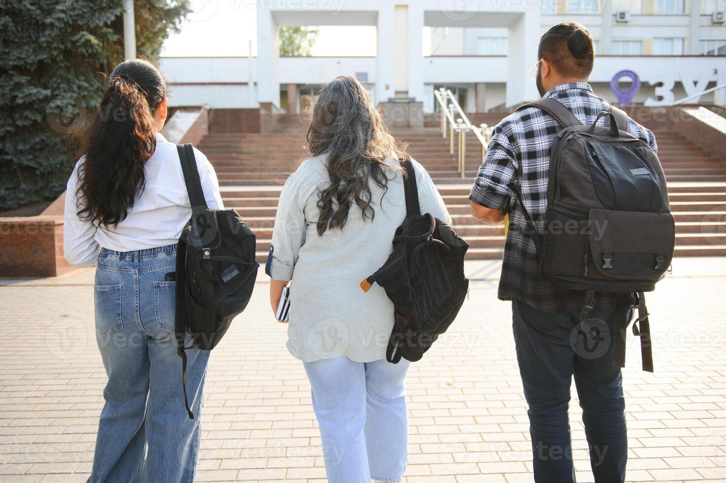 Cheerful Indian asian young group of college students or friends together photo