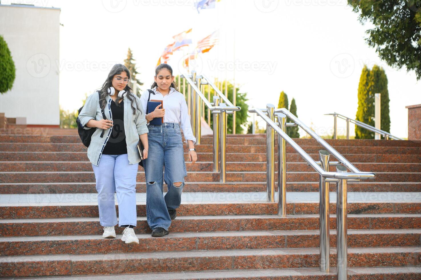 Group of smiling multiethnic near university campus photo