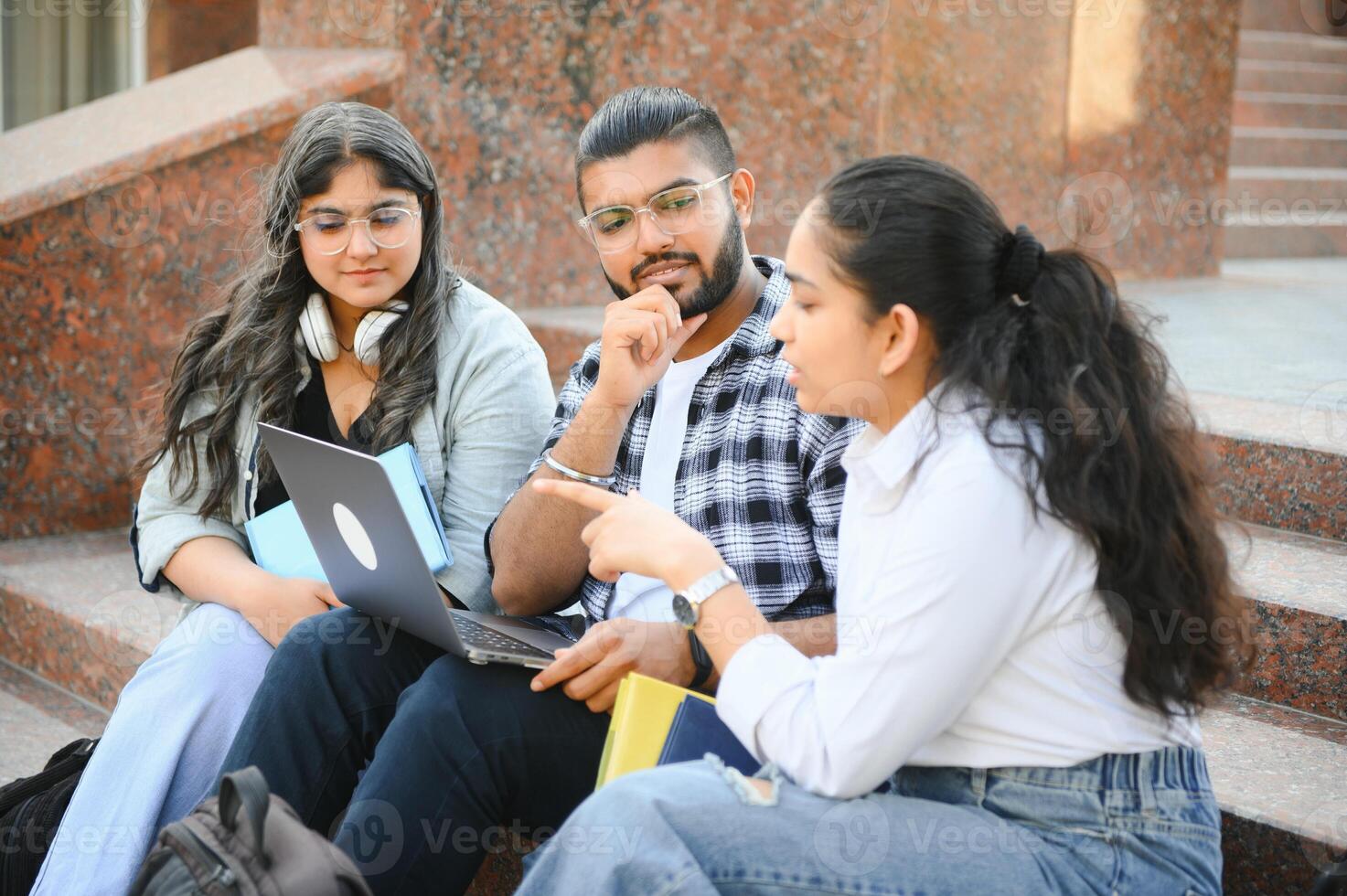 Cheerful Indian asian young group of college students or friends together photo