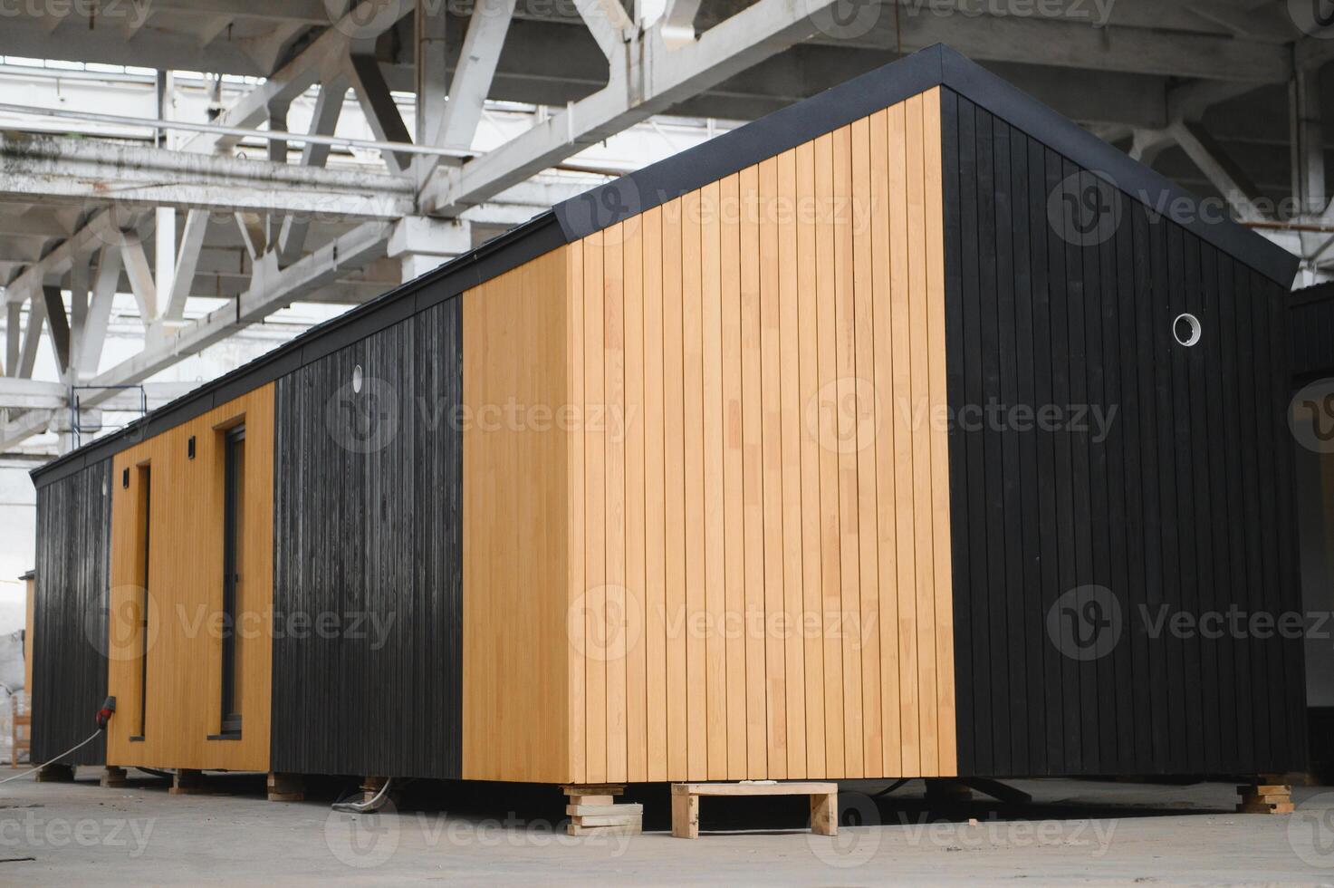 A new wooden modular prefabricated house inside in manufacturing facility photo