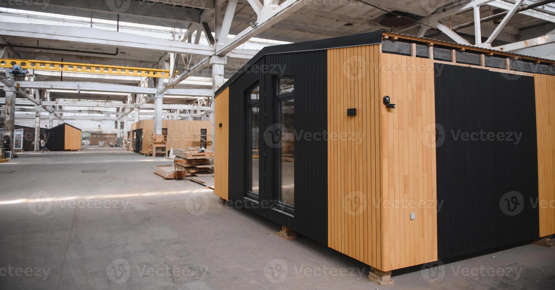 Production of new wooden modular houses. Construction site photo