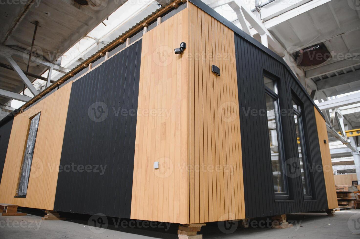 Production of new wooden modular houses. Construction site photo