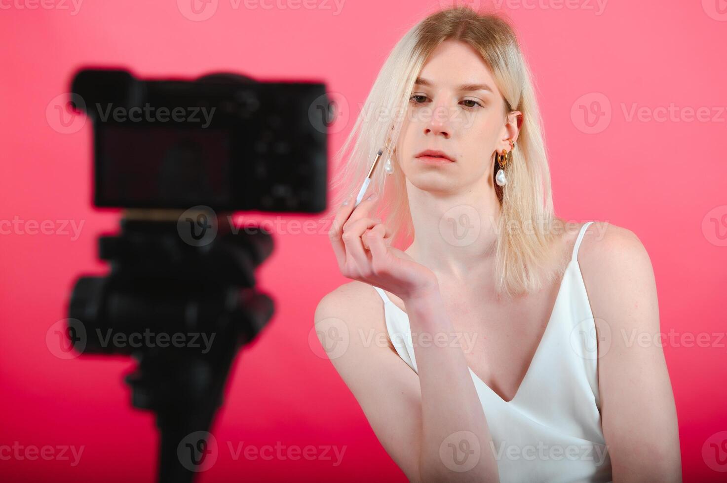 transgender posing isolated in studio. portrait of male model wearing make-up. photo