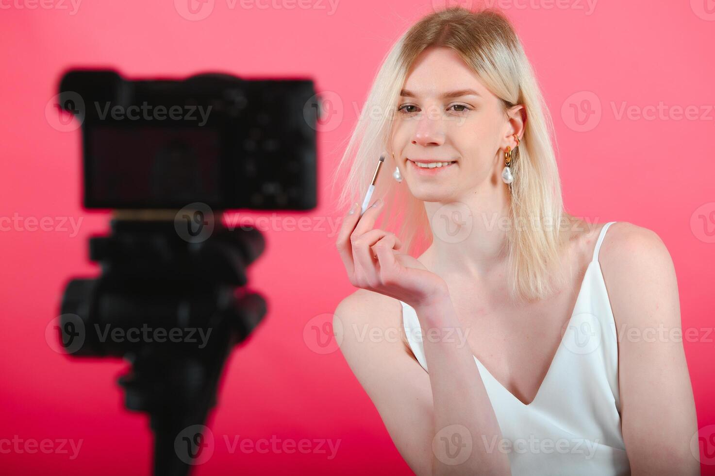 transgender posing isolated in studio. portrait of male model wearing make-up. photo