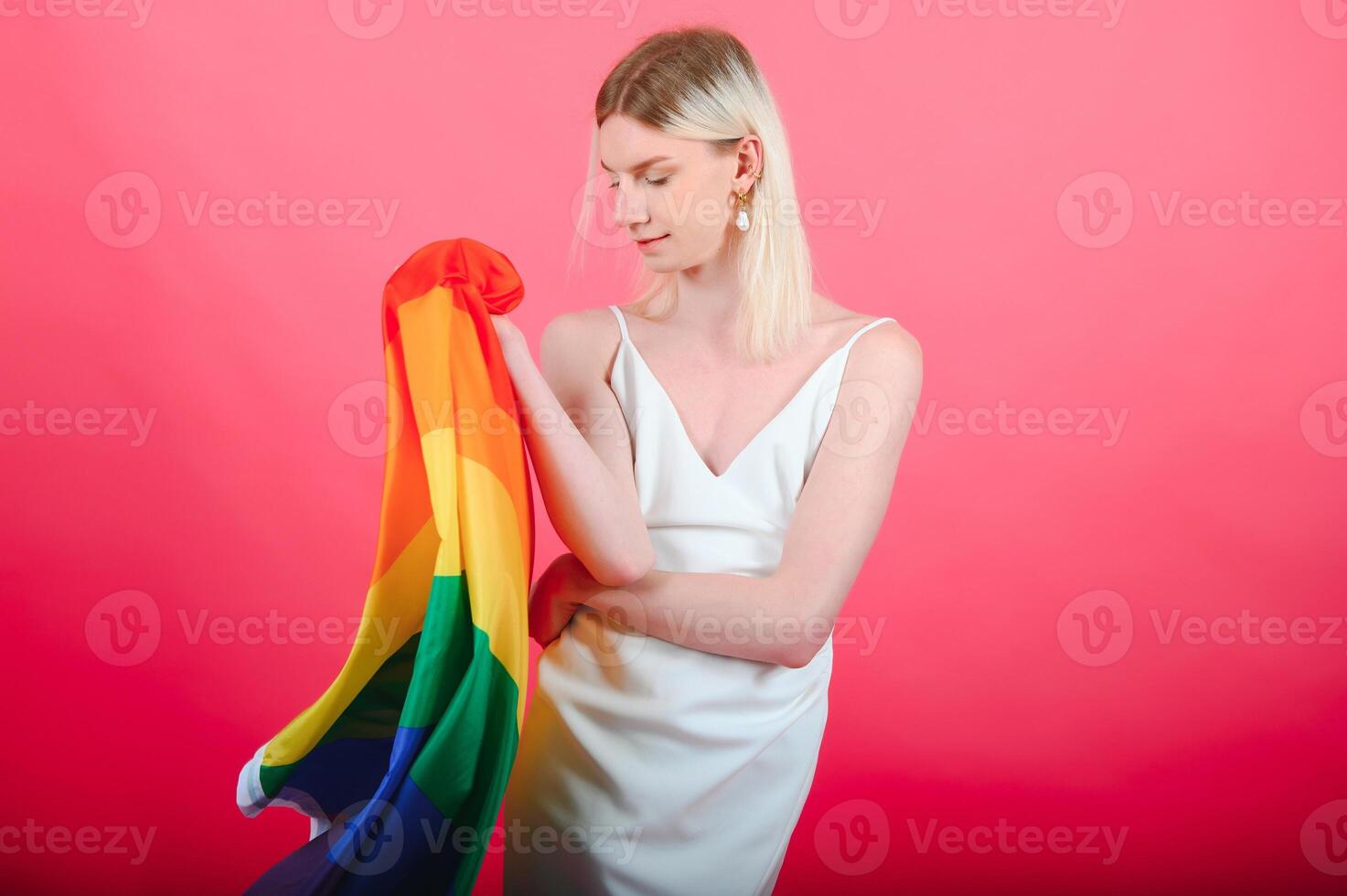 Portrait of young transgender woman on color background photo